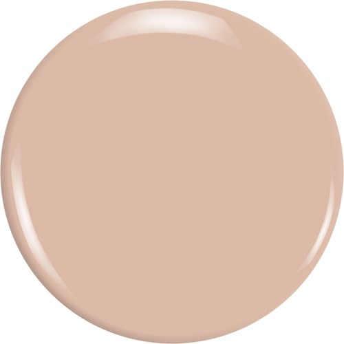 En beige cirkulär föremål, glänsande med reflektioner, verkar vara slätt och platt.
