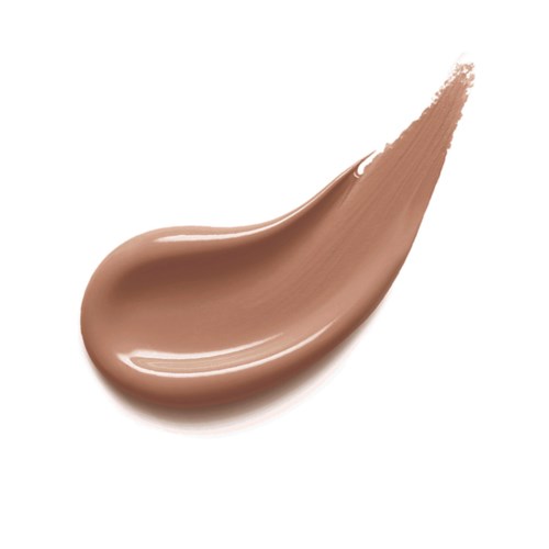 En tjock, beigefärgad makeup- eller hudvårdscreme på en vit bakgrund.