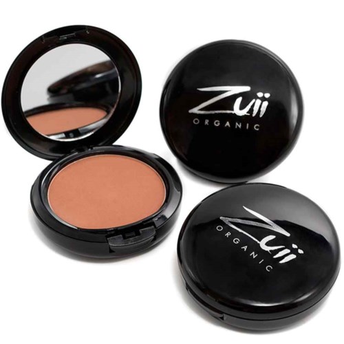 Two black round containers of Zui Organic makeup, one open showing peach-colored powder, and a mirror inside the lid.