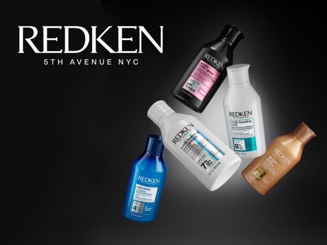 Four bottles of Redken hair care products in different colors on a black background.