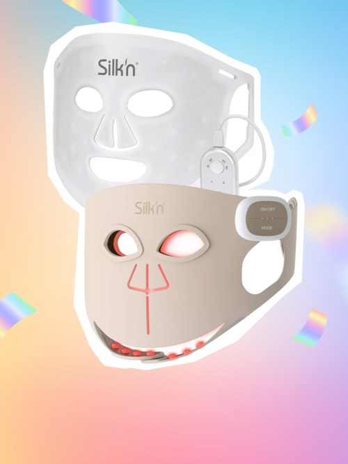 Silk'n gezichtsmaskers met lichten en schattige gezichtskenmerken op een regenboogachtergrond.