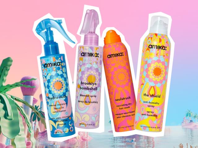 Four colorful spray bottles with floral designs, set against a pink and blue background, look fun and colorful.