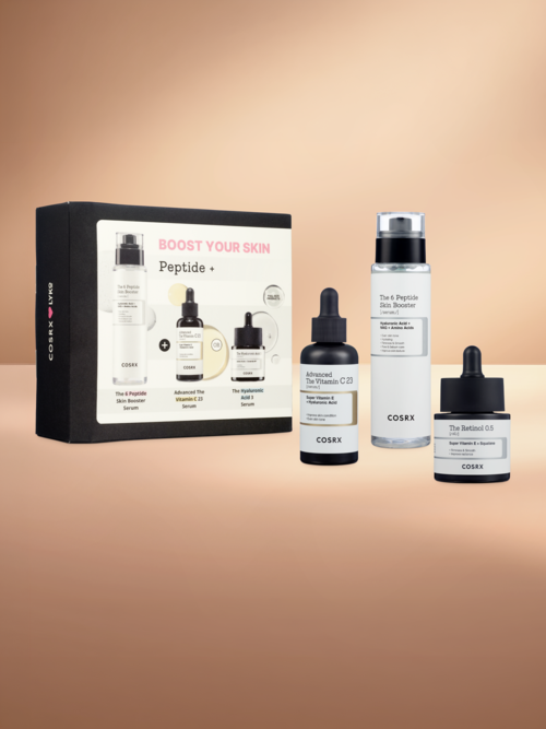 Set med hudvårdsprodukter inklusive tre flaskor med pipetter och en box med produktbilder.