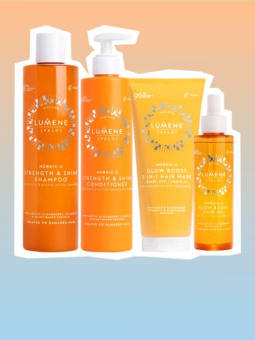 Fyra orange flaskor och tuber med Lumene hudvårdsprodukter, inklusive schampo, balsam, ansiktsmask och serum, mot en rosa och blå gradientbakgrund.
