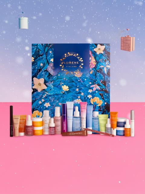 Assorted skincare and beauty products in front of a blue and floral illustrated box against a pink and blue background.
