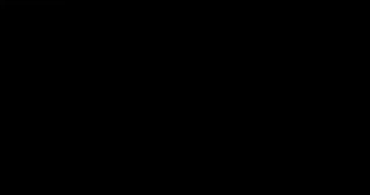 En svartvit logotyp med en stiliserad bild av ett varghuvud och viss text.