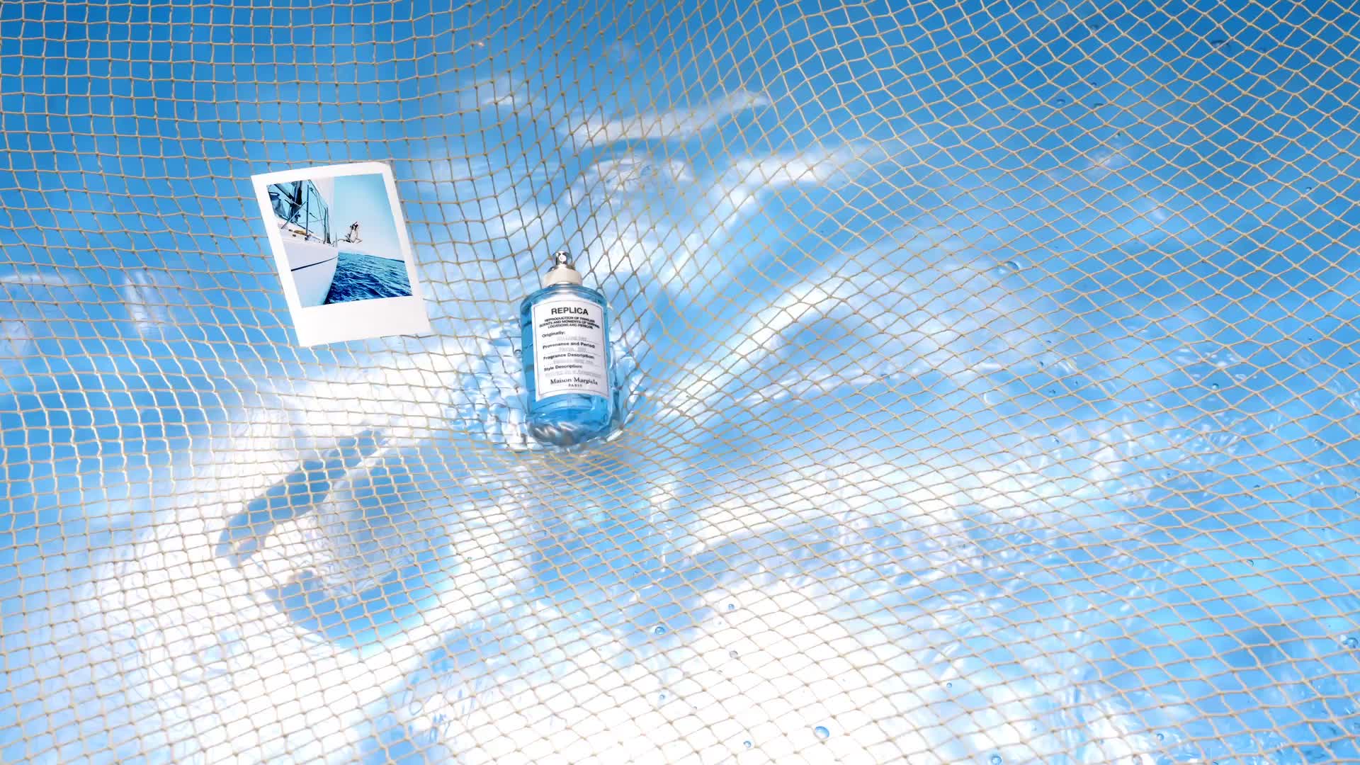 A medicine bottle is caught in a net with a polaroid photo and a swimming pool background.